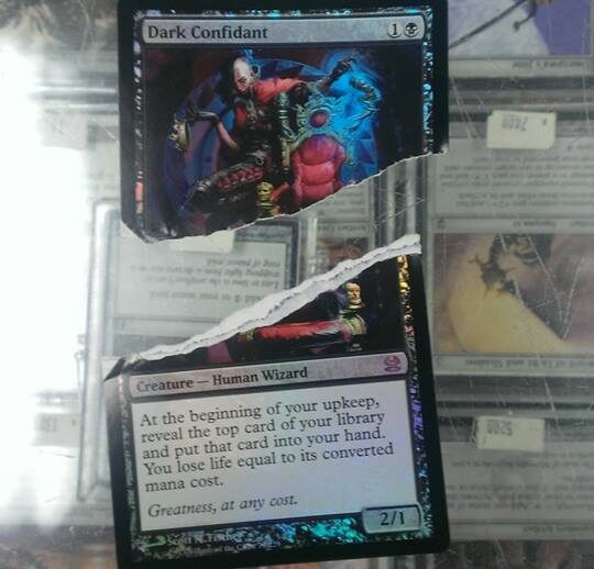 A damaged foil copy of Dark Confidant, a casualty of Flip It Or Rip It from 2014. Image source: M. Haynes