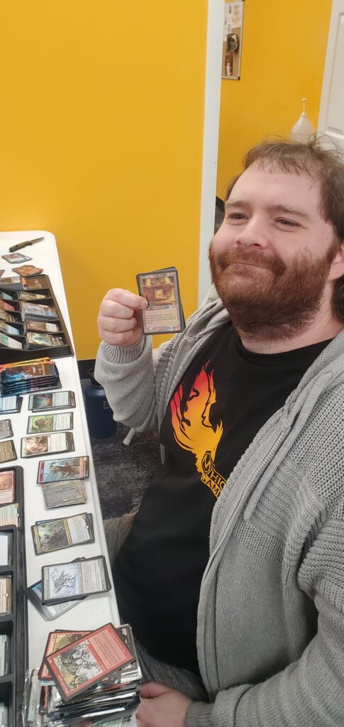 Buster Ledet of Mythic Games in Lakewood, CO, with his store's serialized Sacred Foundry. Image source: Kory Rutherford
