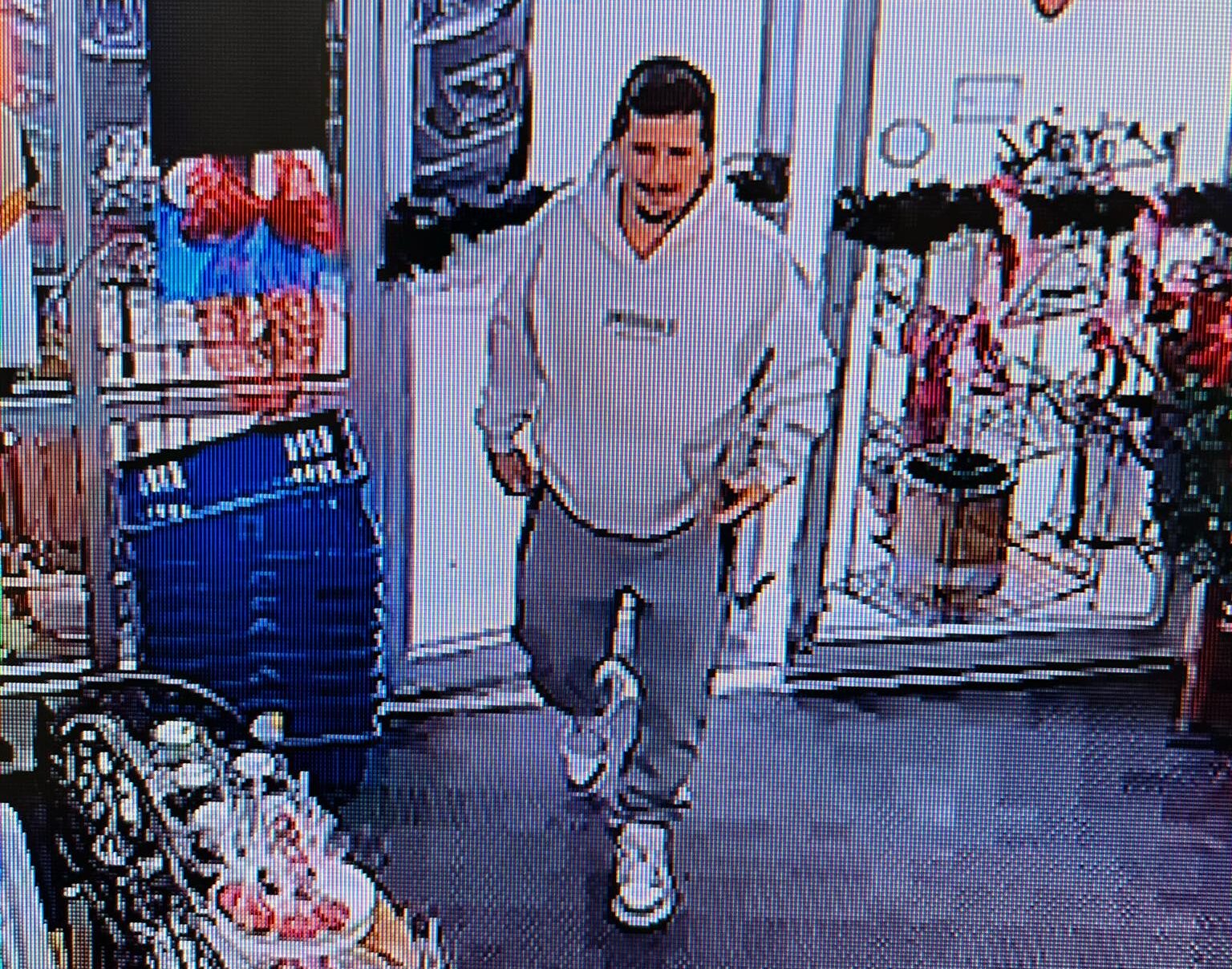 A CCTV still showing one of the alleged card thieves, now identified to be Brooks Allen Clinton. Image Source: Champaign Sports Cards